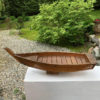 wooden boat display for flowers or sushi